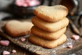 Homemade heart-shaped cookies without decoration on an old wooden table. Homemade pastries. Valentineâs Day concept.