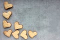 Homemade heart shaped cookies on a gray concrete background. Valentines day treats. Royalty Free Stock Photo