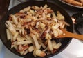 Homemade hearty lunch pan with fried potatoes and onions