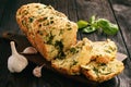 Homemade herb bread loaf with garlic and cheese.