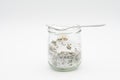 Homemade herbal salt in a glass jar for storage isolated on a white background