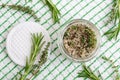 Homemade herbal scrub foot soak or bath salt with rosemary, thyme, sea salt and olive oil. Natural skin and hair care.