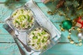 A homemade holiday snack Christmas table. Salad with squid, radish, sea cabbage, rice and egg. Royalty Free Stock Photo