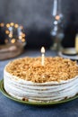 Homemade honey birthday cake with a candle, honey cake