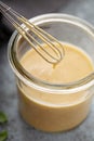 Homemade honey mustard dressing in a glass jar Royalty Free Stock Photo