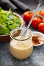 Homemade honey mustard sauce in a glass jar