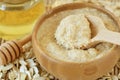 Homemade honey and oatmeal face mask in wooden bowl with spoon