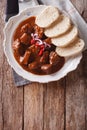 Homemade hot Czech goulash with knodel close-up. vertical top vi