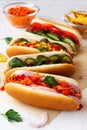 Homemade hot dogs with carrot and chips on the white table Royalty Free Stock Photo