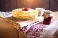 Homemade hot pancakes with jam. Rustic style, crepes closeup. Royalty Free Stock Photo