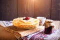 Homemade hot pancakes with jam. Rustic style, crepes closeup. Royalty Free Stock Photo