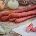 Juicy sausages for barbecue wooden table background.Homemade hotdog sausages