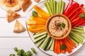 Homemade hummus with assorted fresh vegetables and pita bread. Royalty Free Stock Photo
