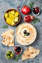 Homemade hummus with paprika, olive oil. Middle Eastern traditional and authentic arab cuisine. Meze party food.