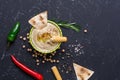 Homemade hummus with pita and grissini bread sticks, chilli, jalapeno on black stone table. Middle Eastern traditional and Royalty Free Stock Photo