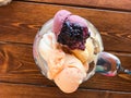 Homemade Ice Cream with Jam in Glass Bowl on Wooden surface. Royalty Free Stock Photo