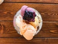 Homemade Ice Cream with Jam in Glass Bowl on Wooden surface. Royalty Free Stock Photo