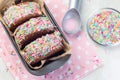 Homemade ice cream sandwich with chocolate chip cookie, watermelon ice cream,  covered with colorful sprinkles, horizontal, top Royalty Free Stock Photo