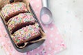 Homemade ice cream sandwich with chocolate chip cookie, watermelon ice cream,  covered with colorful sprinkles, horizontal, top Royalty Free Stock Photo