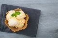 Homemade Ice cream scoops with vanilla ice cream in a bowl with mint. Top view