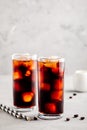 Homemade iced coffee with ice cubes in tall glasses Royalty Free Stock Photo