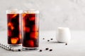 Homemade iced coffee with ice cubes in tall glasses Royalty Free Stock Photo