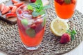 Homemade iced tea with strawberries and mint on a wooden table, Royalty Free Stock Photo