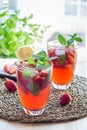 Homemade iced tea with strawberries and mint on wooden table, vertical Royalty Free Stock Photo