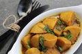 Homemade Indian Taro root  curry or Yam curry on a wooden moody background Royalty Free Stock Photo