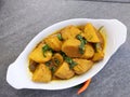 Homemade Indian Taro root  curry or Yam curry on a wooden moody background Royalty Free Stock Photo