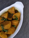 Homemade Indian Taro root  curry or Yam curry on a wooden moody background Royalty Free Stock Photo