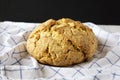 Homemade Irish Soda Bread on cloth, side view. Close-up