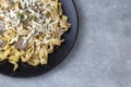 Homemade Italian fettuccine pasta (Fettuccine al Funghi Porcini) with mushroom and cream sauce Royalty Free Stock Photo