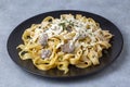 Homemade Italian fettuccine pasta (Fettuccine al Funghi Porcini) with mushroom and cream sauce. Royalty Free Stock Photo