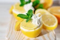 Homemade italian lemon sorbet decorated with mint. Homemade icecream in lemon decorated with mint. Sorbetto al limone