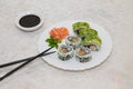 Homemade Japanese sushi plate. Salmon and shrimp rolls with avocado and sesame seeds. Royalty Free Stock Photo