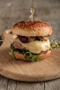 Homemade juicy burger with beef, cheese and caramelized onions. Royalty Free Stock Photo