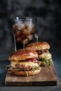 Homemade juicy burgers with beef, cheese and caramelized onions. Royalty Free Stock Photo