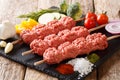 Homemade kebabs from raw minced meat on skewers with spices, her Royalty Free Stock Photo