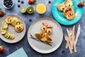 Homemade keto diet pancakes in critter shapes served with fruit and juice.