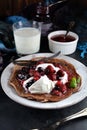 Keto Chocolate Pancakes with Whipped Cream and Berries