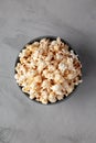 Homemade Kettle Corn Popcorn with Salt in a Bowl, top view. Flat lay, overhead, from above