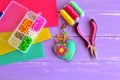 Homemade keychain felt embellished with beads. Box with beads, pliers, felt sheets, needle, thread