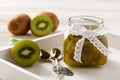 Homemade kiwi jam in glass jar.