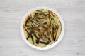 Homemade korean Pajeon scallion pancake on a white plate on a white wooden table, view from above. Asian food. Flat lay, top view Royalty Free Stock Photo
