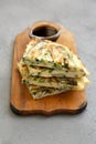 Homemade korean Pajeon scallion pancakes with soy sauce on a rustic wooden board on a gray background, side view. Asian food Royalty Free Stock Photo