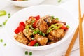 Homemade kung pao chicken with peppers and vegetables.