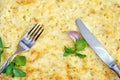 Homemade lasagna with parmesan cheese. top view. knife and fork and delicious lasagna cheese crust. Royalty Free Stock Photo