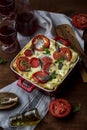 Homemade lasagne bolognese in a ceramic form Royalty Free Stock Photo