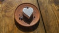 Homemade lavender ice cream in in the shape of a heart in rural clay plate decoration blueberry. Creamy vegan lavender